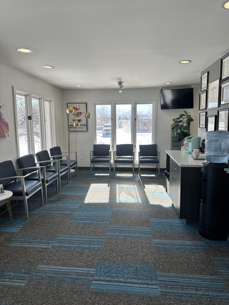 A spacious and well-lit waiting area at Hillside Family Dentist, featuring comfortable seating and a welcoming atmosphere.
